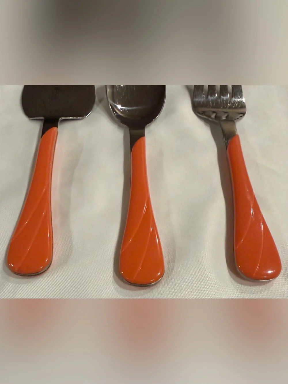 Fiesta ware 3 piece serving set, orange swirl pattern,fork/spoon/cake/pie server